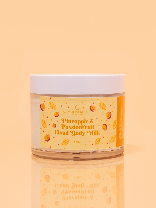 Hydrating Pineapple passionfruit Cloud Body Milk by MoonFruit Cosmetics – luxurious, lightweight body moisturizer in a whipped cream texture. Made with shea butter, mango butter, sunflower seed oil, ideal for hydrating and nourishing dry skin. Product styled with tropical elements for a clean, natural skincare appeal